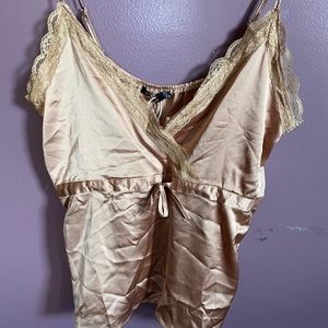 Satin feel lace trimmed camisole tank top.